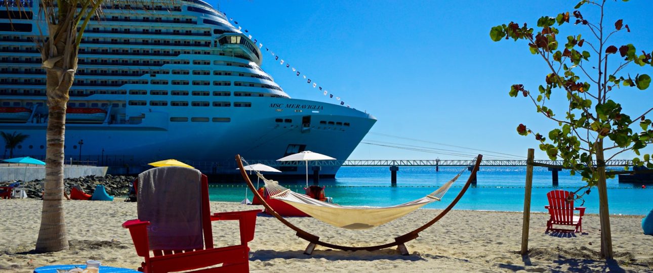 white and blue cruise ship on sea shore during daytime