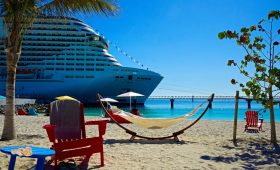 white and blue cruise ship on sea shore during daytime